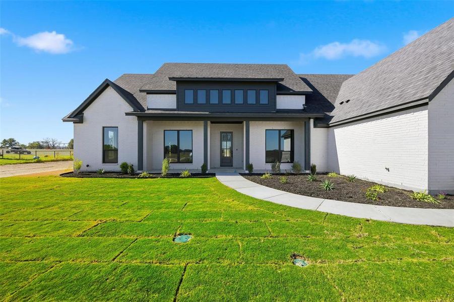 Front exterior of a new home in , Poolville, TX, highlighting curb appeal (Image 21).