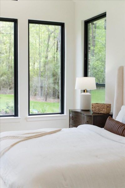 The primary suite feels like the place where the world finally gets quiet — where long days end softly and mornings begin without rushing.