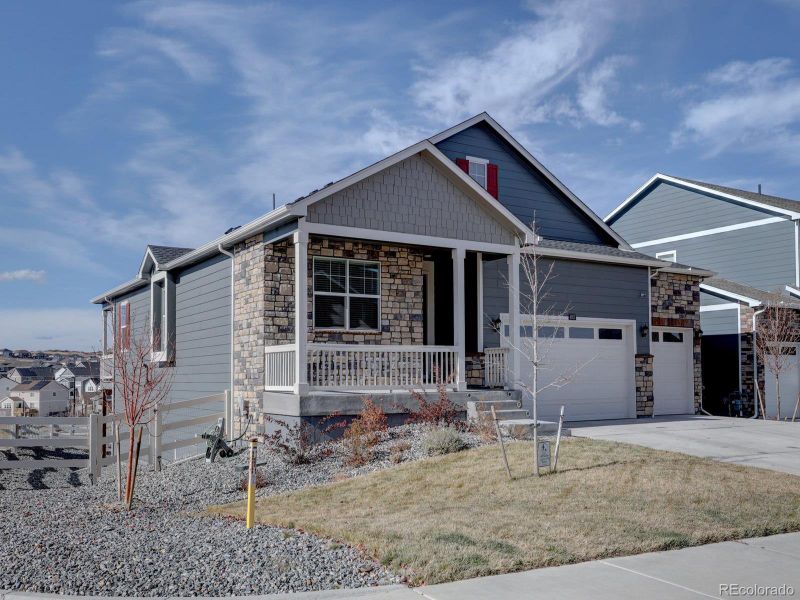 Front exterior of a new home in Crystal Valley Pine Ridge, Castle Rock, CO, highlighting curb appeal (Image 1).