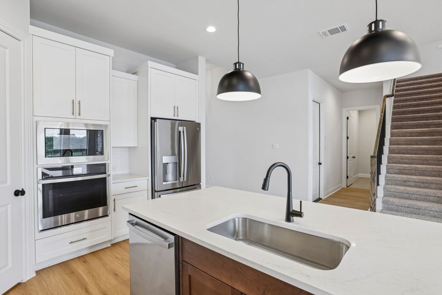 Furnished interior view inside a new home in 6 Creeks, Kyle (Image 5).