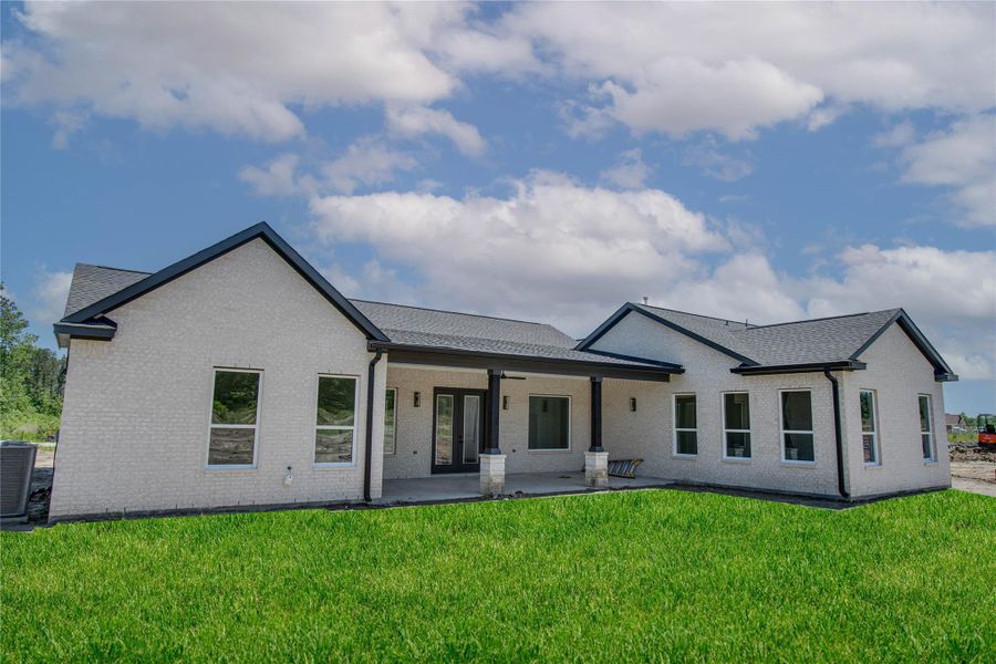 Front exterior of a new home in , Dayton, TX, highlighting curb appeal (Image 23).