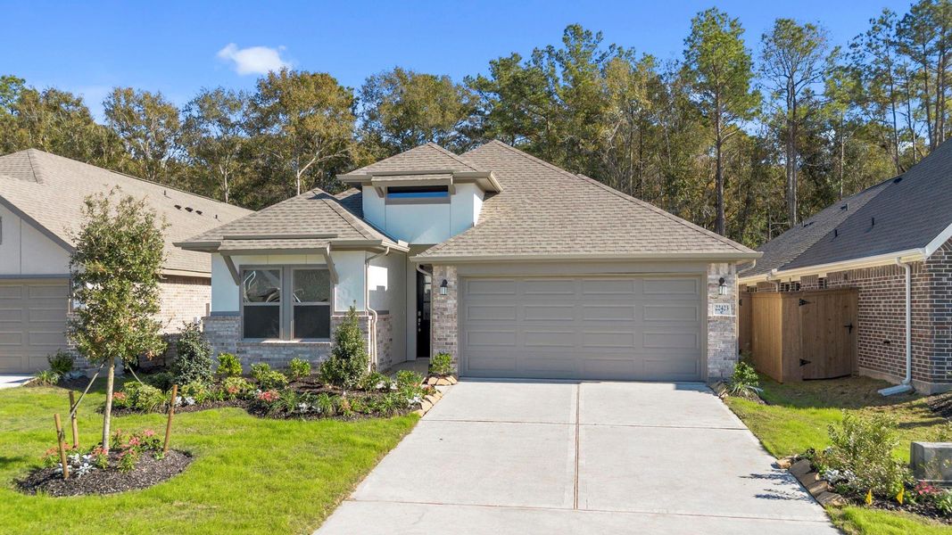 Front exterior of a new home in The Highlands 45', Porter, TX, highlighting curb appeal (Image 23).