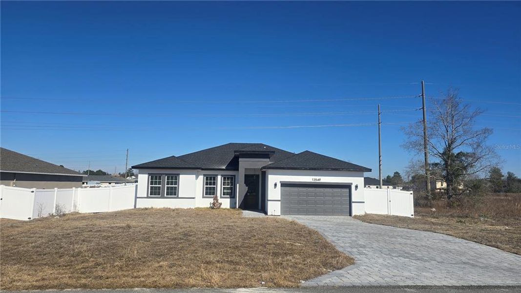 Front exterior of a new home in , Ocala, FL, highlighting curb appeal (Image 2). Front exterior of a new home in , Ocala, FL, highlighting curb appeal (Image 2).