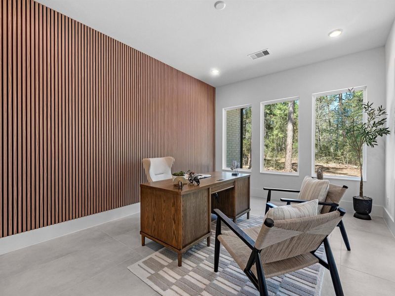 This room  provides a quiet, light-filled space ideal for working from home or creative pursuits.