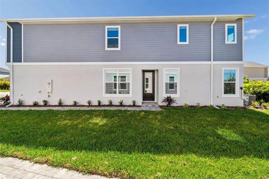Exterior details and patio area of a home in North River Ranch – Townhomes, Parrish (Image 30).