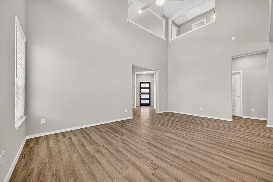 Spacious, unfurnished interior of a new home in Sunterra, Katy (Image 31).