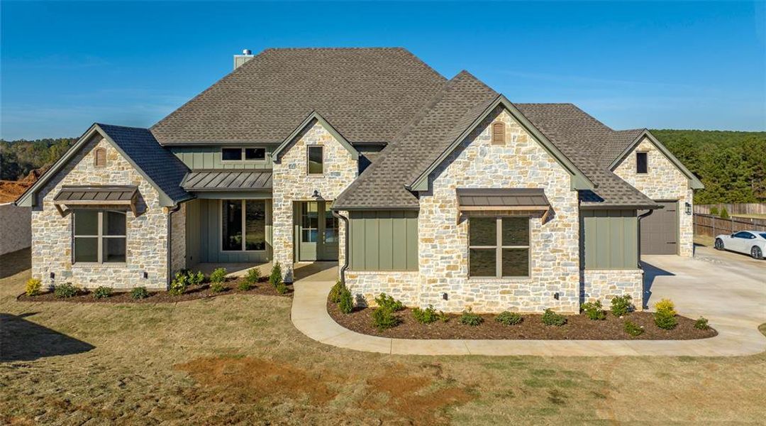 Front exterior of a new home in , Longview, TX, highlighting curb appeal (Image 23).