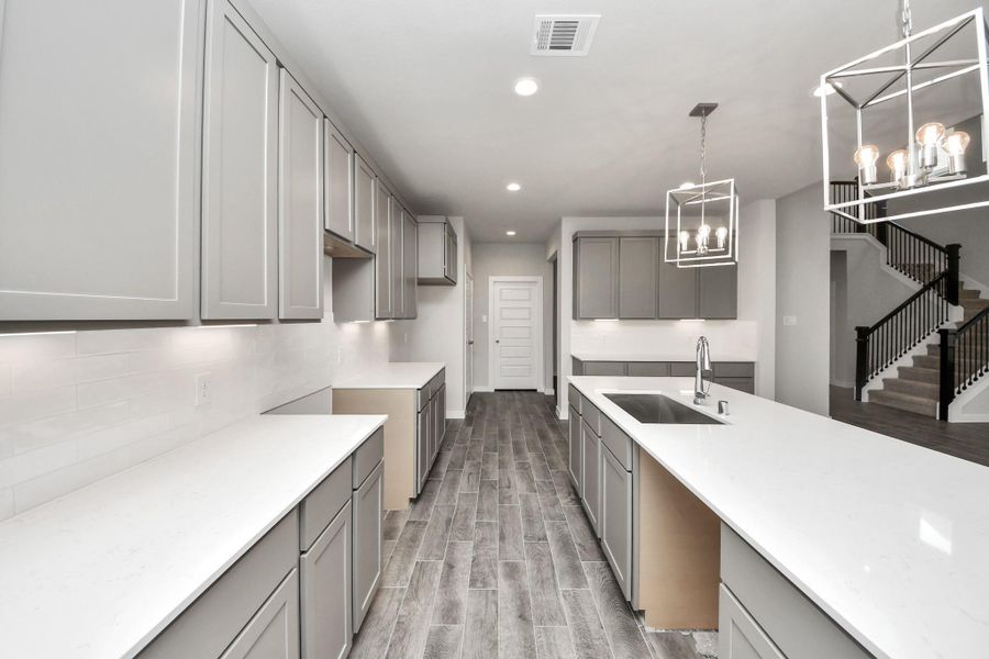The extended counter area adds both practicality and style, making meal preparation a breeze. Every detail is thoughtfully designed to enhance the kitchen's functionality and aesthetic appeal. The extended counter area adds both practicality and style, making meal preparation a breeze. Every detail is thoughtfully designed to enhance the kitchen's functionality and aesthetic appeal.
