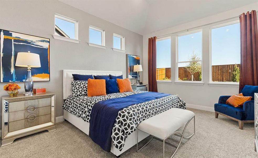 Bedroom featuring multiple windows and carpet floors