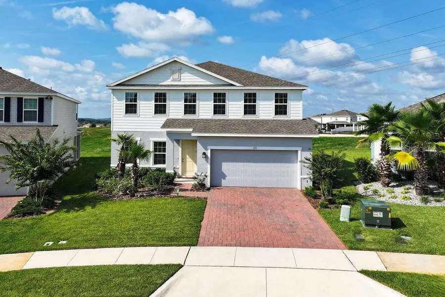 Front exterior of a new home in , Minneola, FL, highlighting curb appeal (Image 24). Front exterior of a new home in , Minneola, FL, highlighting curb appeal (Image 24).