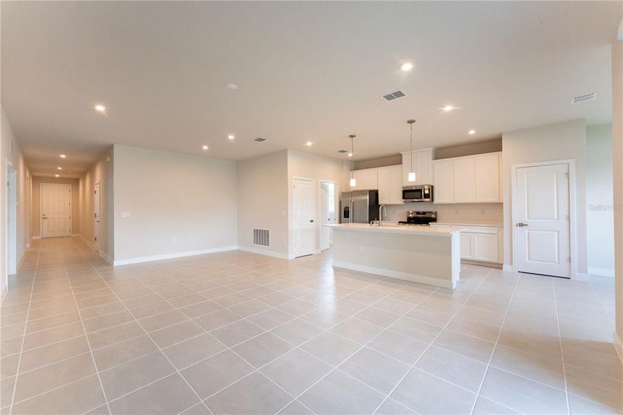 Spacious, unfurnished interior of a new home in The Palms at Venetian Bay, New Smyrna Beach (Image 13).