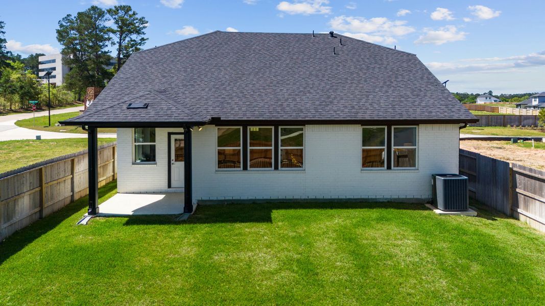 Exterior details and patio area of a home in Montgomery Ridge, Montgomery (Image 2).
