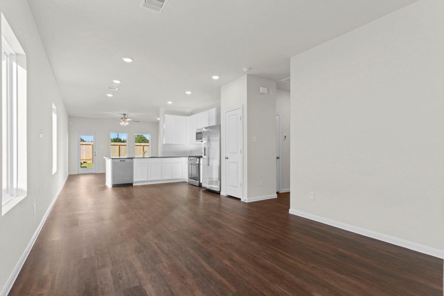 Step inside to the welcoming dining area that sets the tone for the home’s open-concept design. Gorgeous vinyl plank wood flooring flows throughout, creating a seamless connection between spaces and adding a touch of elegance. Step inside to the welcoming dining area that sets the tone for the home’s open-concept design. Gorgeous vinyl plank wood flooring flows throughout, creating a seamless connection between spaces and adding a touch of elegance.