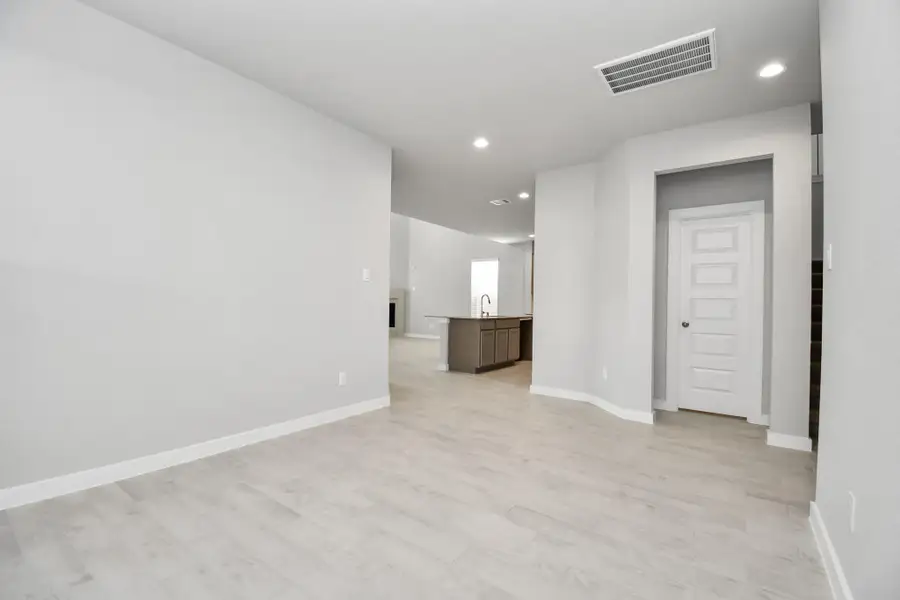 Discover another view of the formal dining area. Sample photo of completed home with similar floor plan. Actual colors and selections may vary.