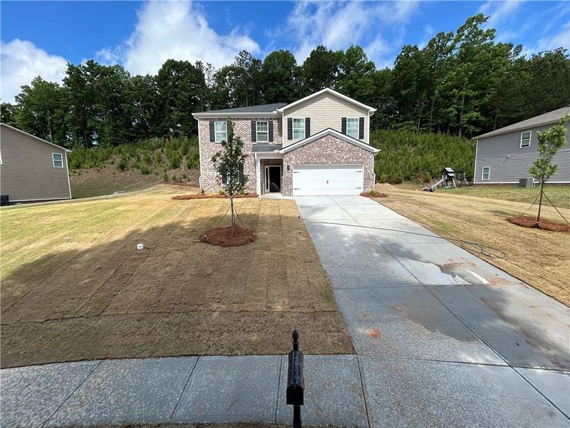 Front exterior of a new home in , Conyers, GA, highlighting curb appeal (Image 2). Front exterior of a new home in , Conyers, GA, highlighting curb appeal (Image 2).
