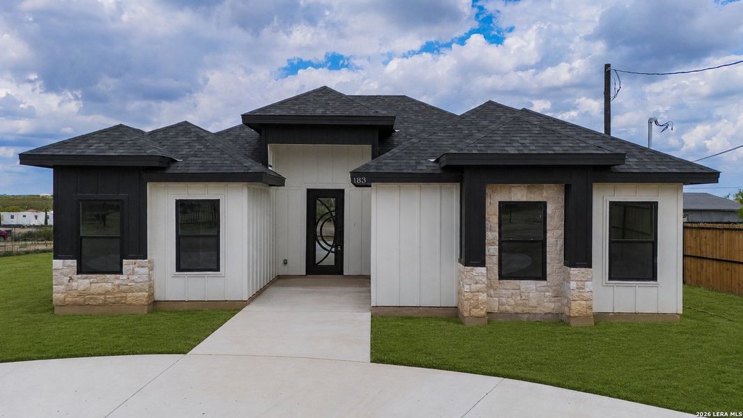 Front exterior of a new home in , Eagle Pass, TX, highlighting curb appeal (Image 1). Front exterior of a new home in , Eagle Pass, TX, highlighting curb appeal (Image 1).