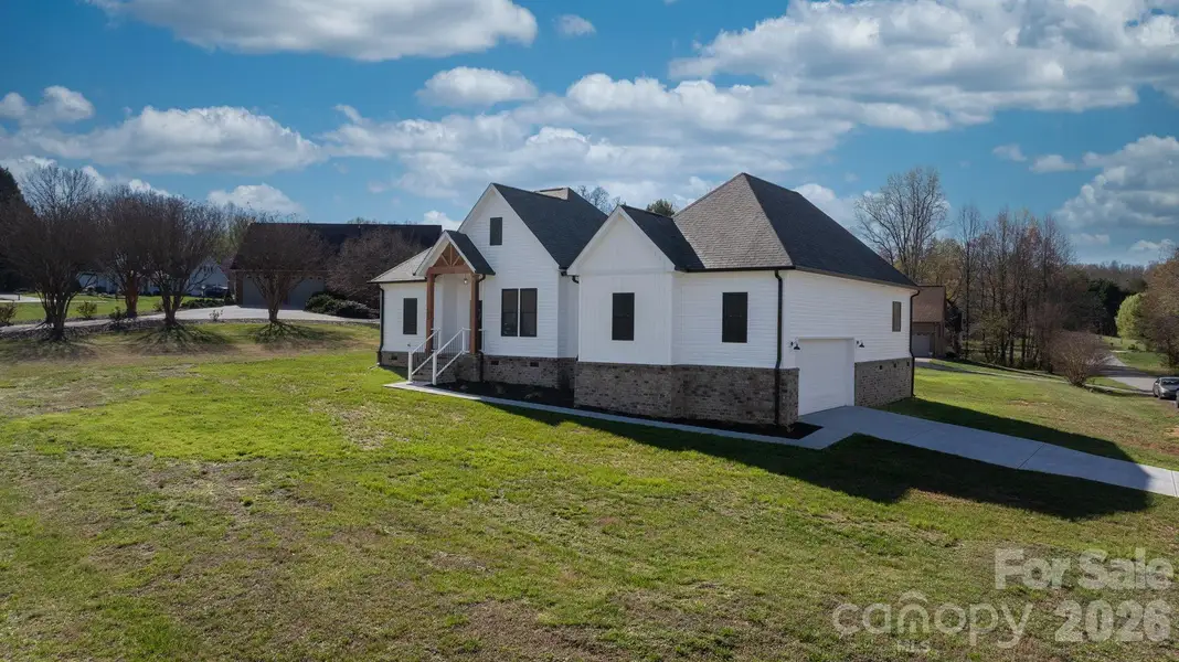 Front exterior of a new home in , Conover, NC, highlighting curb appeal (Image 27).