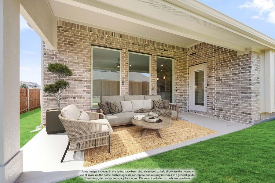 Covered back patio with brick exterior, outdoor seating, and green lawn