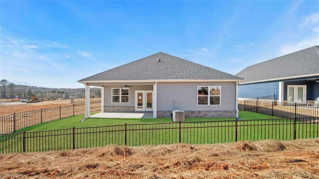 Exterior details and patio area of a home in Oak Ridge Meadows - Active Adult, Locust Grove (Image 2).