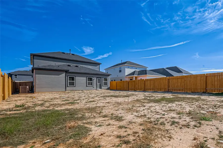 Exterior details and patio area of a home in Mill Creek Trails, Magnolia (Image 3).