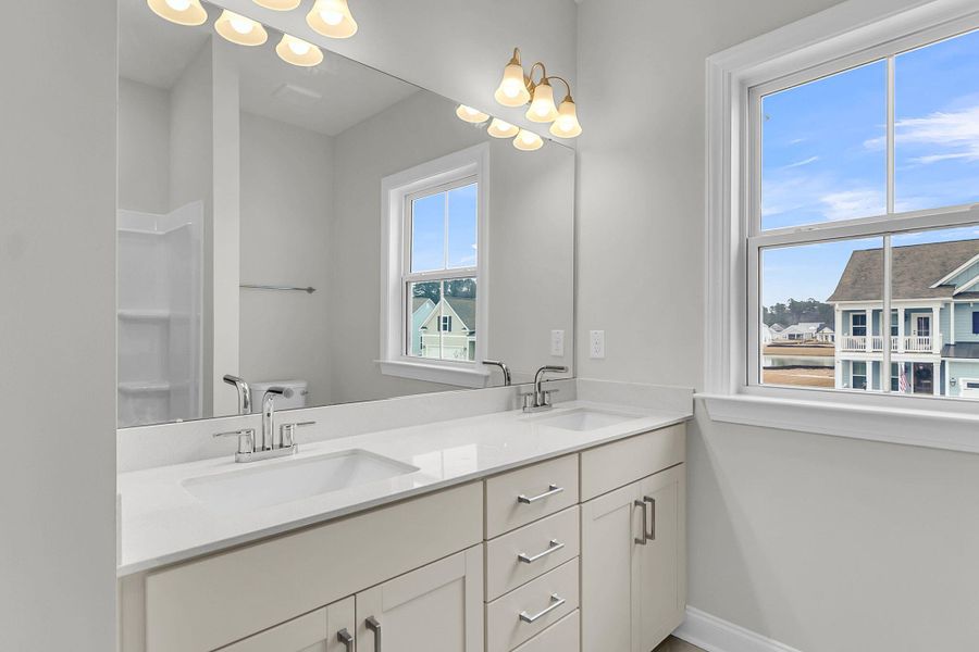 Furnished interior view inside a new home in Tidewater at Lakes of Cane Bay, Summerville (Image 11).
