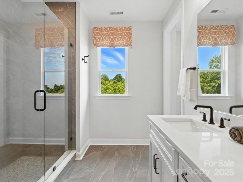 Huge walk-in closet at primary bath. *Model Photos | Actual finishes, structural selections, and orientation may vary.