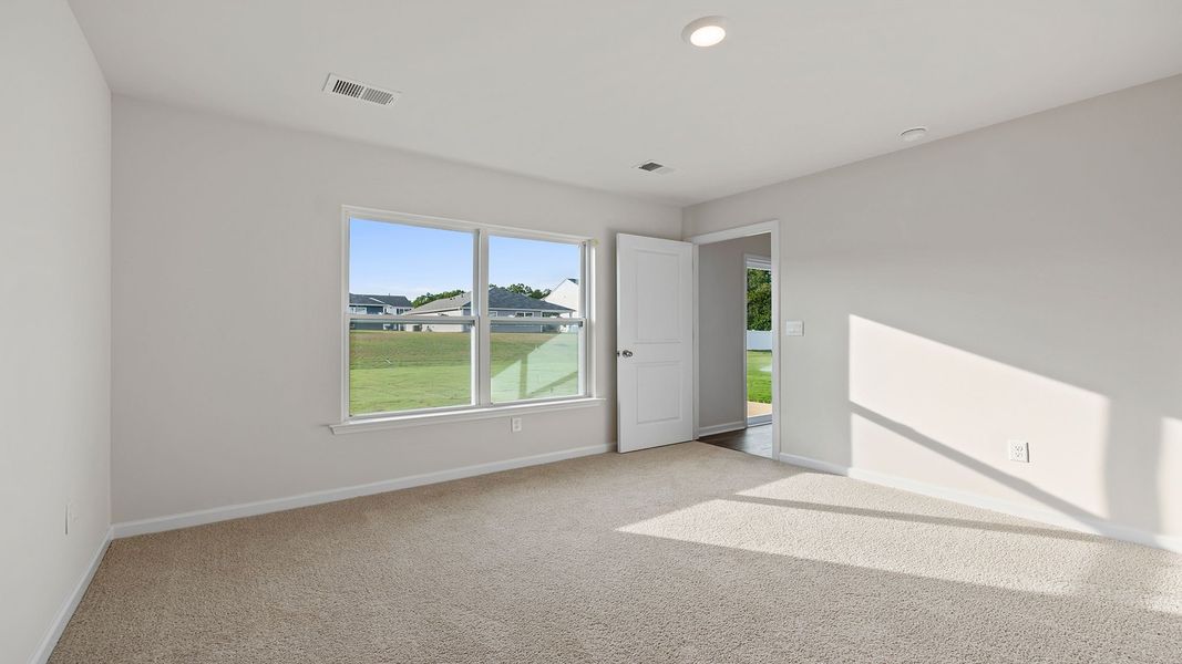 Spacious, unfurnished interior of a new home in Bentley Park, Greenwood (Image 25).