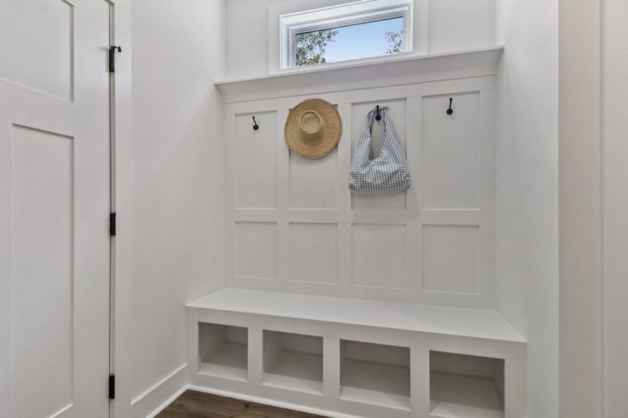 Mudroom featuring dark wood-style flooring