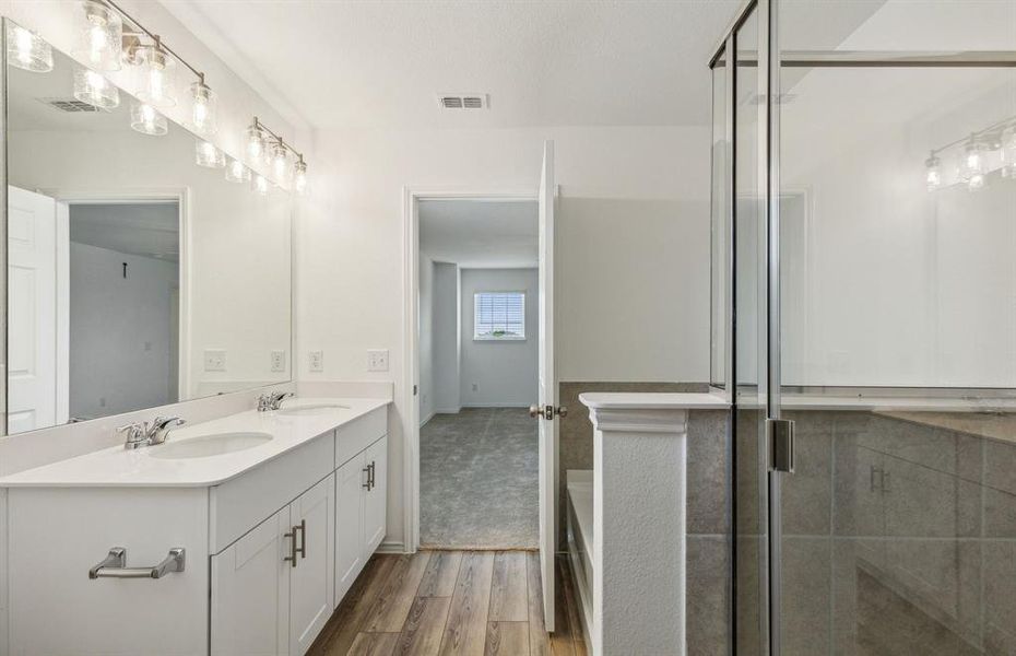 Owner's suite with oversized shower*real home pictured