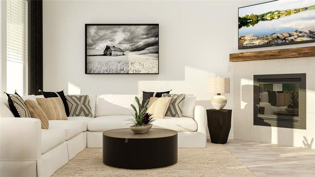 Living room featuring light hardwood / wood-style floors and a fireplace