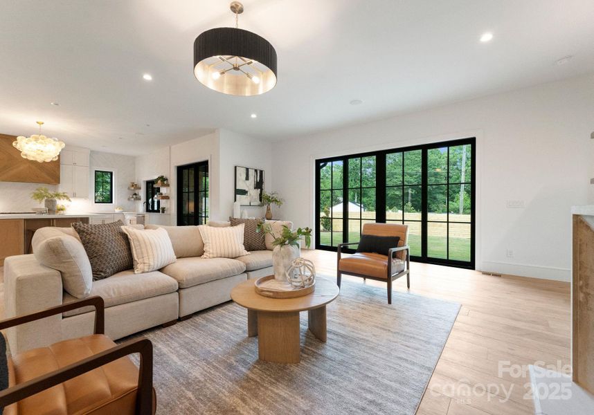 Main level living offers an open concept and lots of natural light with large 8' sliders opening to the backyard. Main level living offers an open concept and lots of natural light with large 8' sliders opening to the backyard.