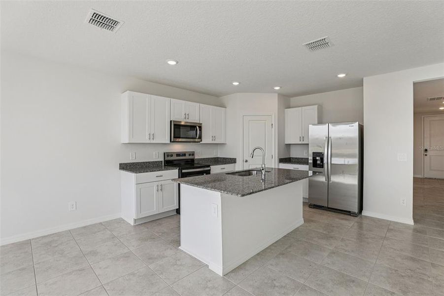 Furnished interior view inside a new home in Crosswinds - Signature Series, Haines City (Image 13).