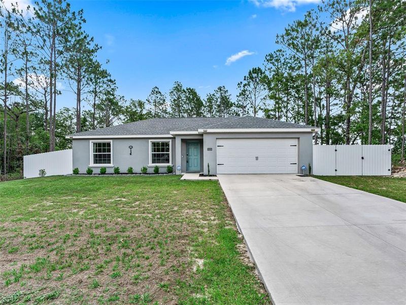 Front exterior of a new home in , Ocala, FL, highlighting curb appeal (Image 21).