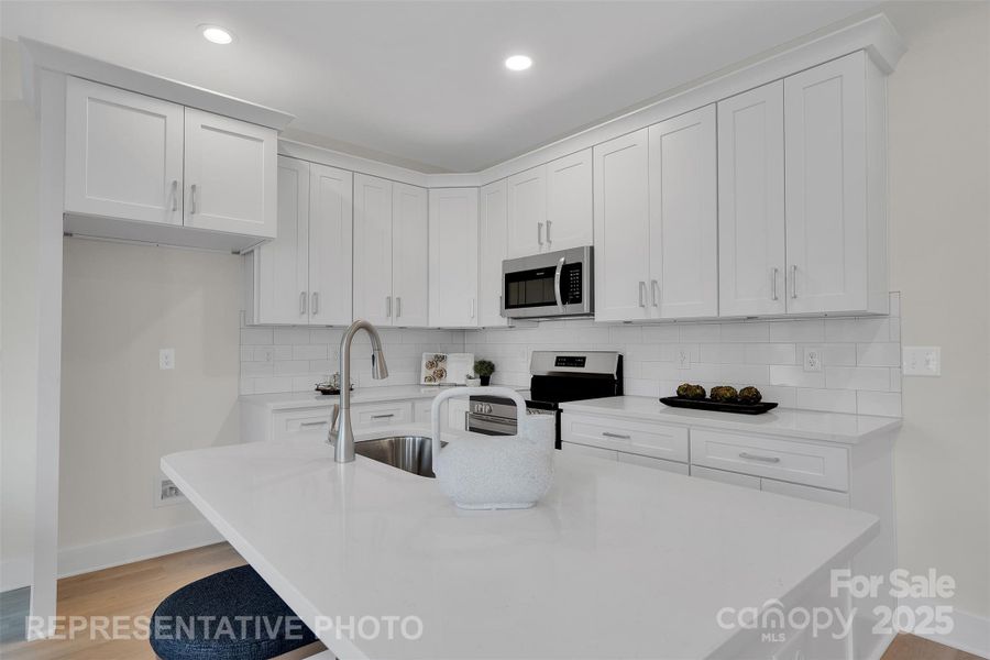 Large island in designer kitchen