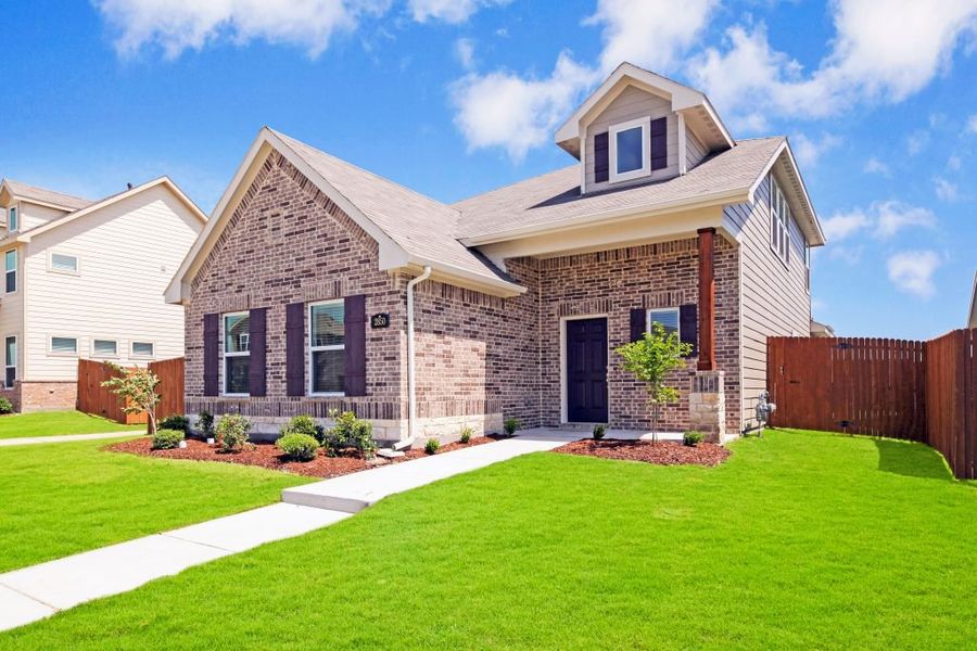 Representative exterior photo of a completed home built from the Lockhart by Impression Homes in Heartland, Heartland, TX (Image 2).