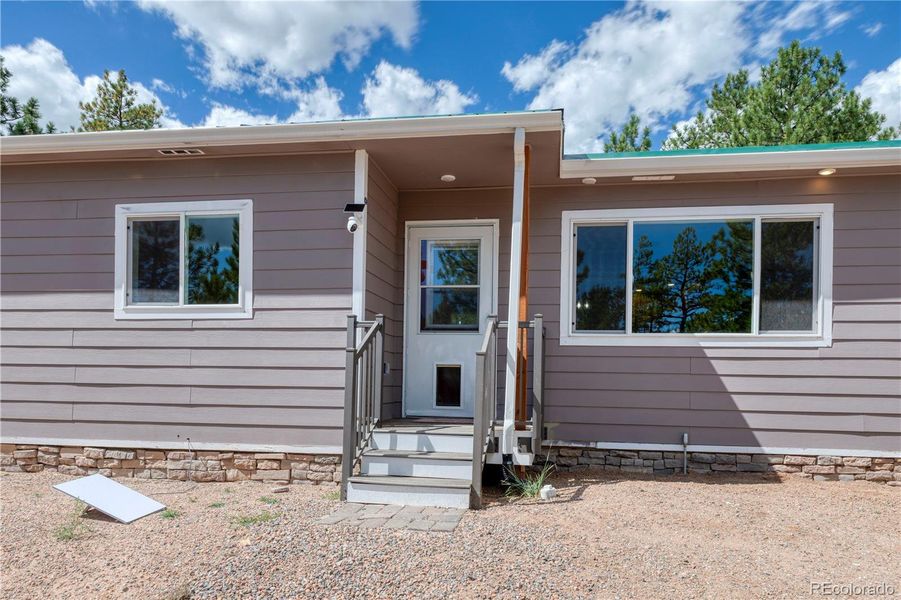 Front exterior of a new home in , Westcliffe, CO, highlighting curb appeal (Image 21).