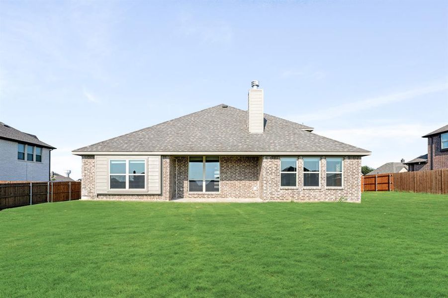 Exterior details and patio area of a home in Coyote Crossing, Godley (Image 27).