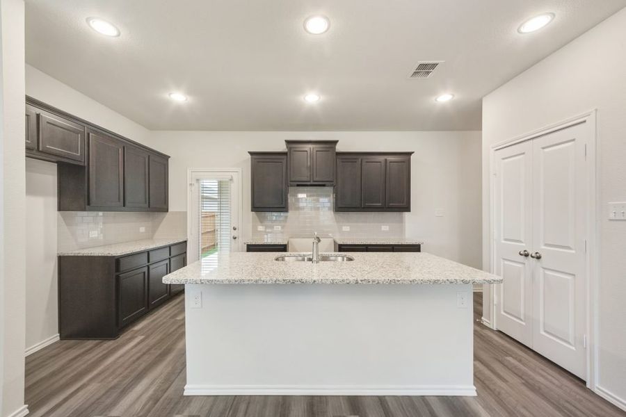 Representative exterior photo of a completed home built from the Harwood by Impression Homes in Heartland, Heartland, TX (Image 6).