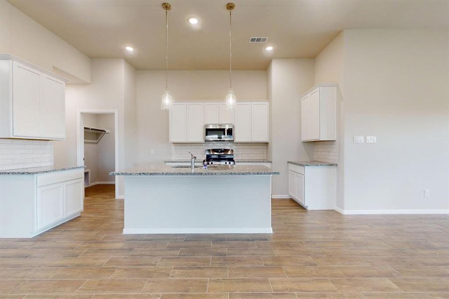 Furnished interior view inside a new home in Prairie Ridge at Goodland, Venus (Image 15).