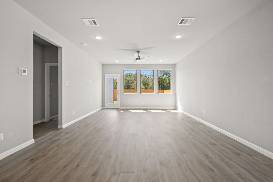 Dining and Living Areas in the Willow home plan by Trophy Signature Homes – REPRESENTATIVE PHOTO