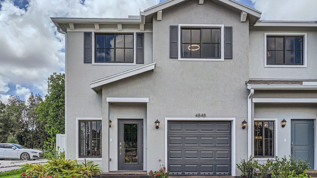 Representative exterior photo of a completed home built from the Topaz by D.R. Horton in Ashwood Cove, Lake Worth, FL (Image 1).