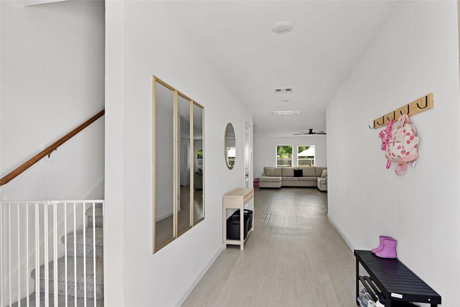 Entry view as you come into the home. Laminate flooring throughout downstairs.