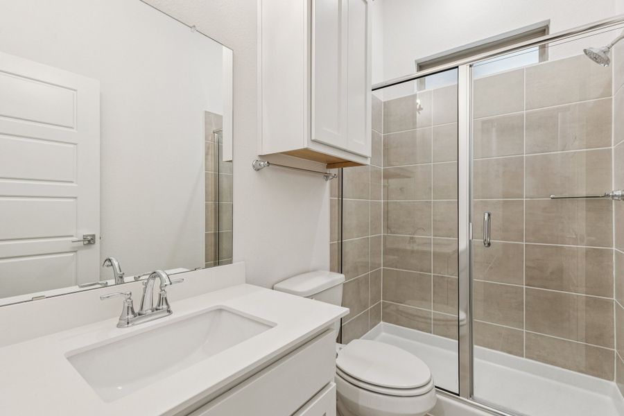 Bathroom in the Picasso II home plan by Trophy Signature Homes – REPRESENTATIVE PHOTO