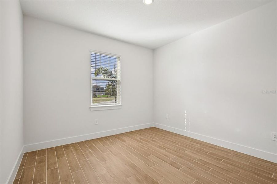 Spacious, unfurnished interior of a new home in Magnolia Bay - Reserve Series, Nokomis (Image 32).