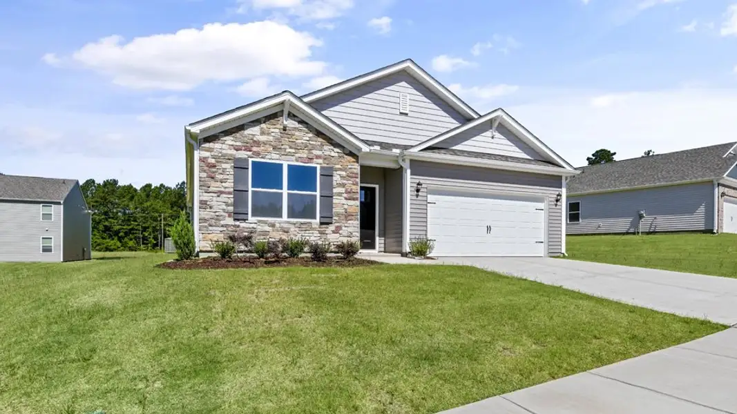 Front exterior of a new home in The Reserve at Prestleigh, Wake Forest, NC, highlighting curb appeal (Image 2). Front exterior of a new home in The Reserve at Prestleigh, Wake Forest, NC, highlighting curb appeal (Image 2).