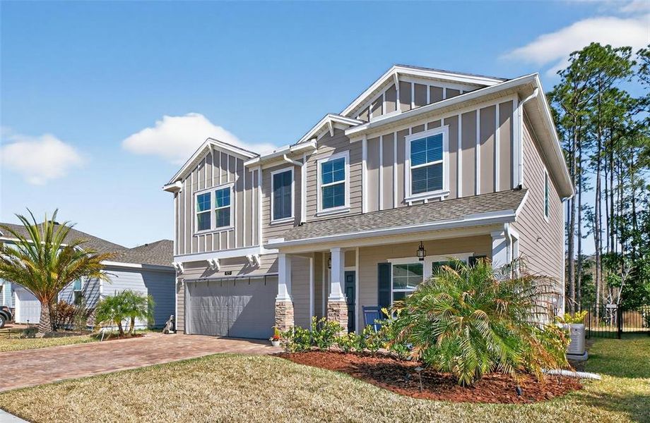Front exterior of a new home in Trailmark, St. Augustine, FL, highlighting curb appeal (Image 23).