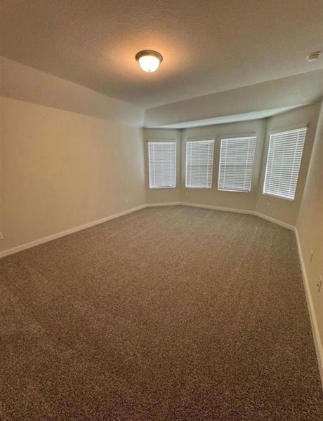Spacious, unfurnished interior of a new home in Wall Street Village, Richmond (Image 18).