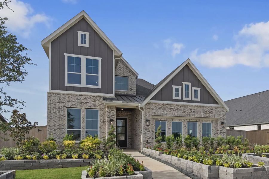 Front exterior of a new home in Meridiana 50's and 60's, Manvel, TX, highlighting curb appeal (Image 22).