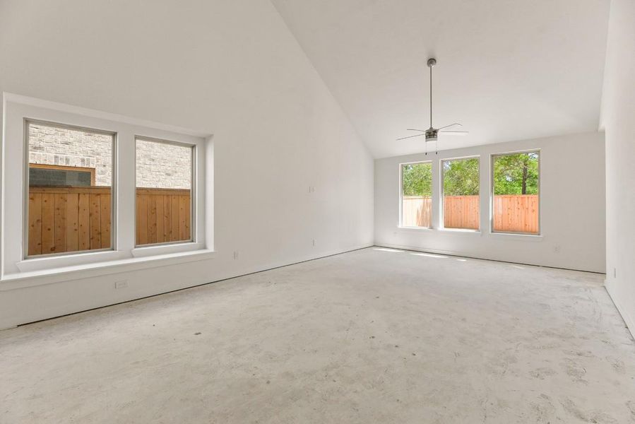 Expansive windows in the dining and family rooms offer serene views of the lush trees and privacy fence, blending the beauty of nature with the comfort of home. Expansive windows in the dining and family rooms offer serene views of the lush trees and privacy fence, blending the beauty of nature with the comfort of home.