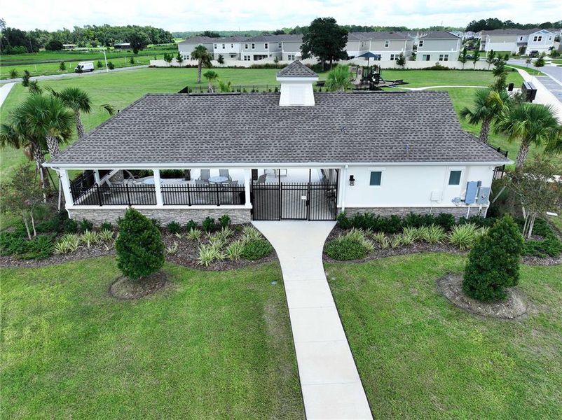 Front exterior of a new home in Pasadena Point, Wesley Chapel, FL, highlighting curb appeal (Image 22). Front exterior of a new home in Pasadena Point, Wesley Chapel, FL, highlighting curb appeal (Image 22).